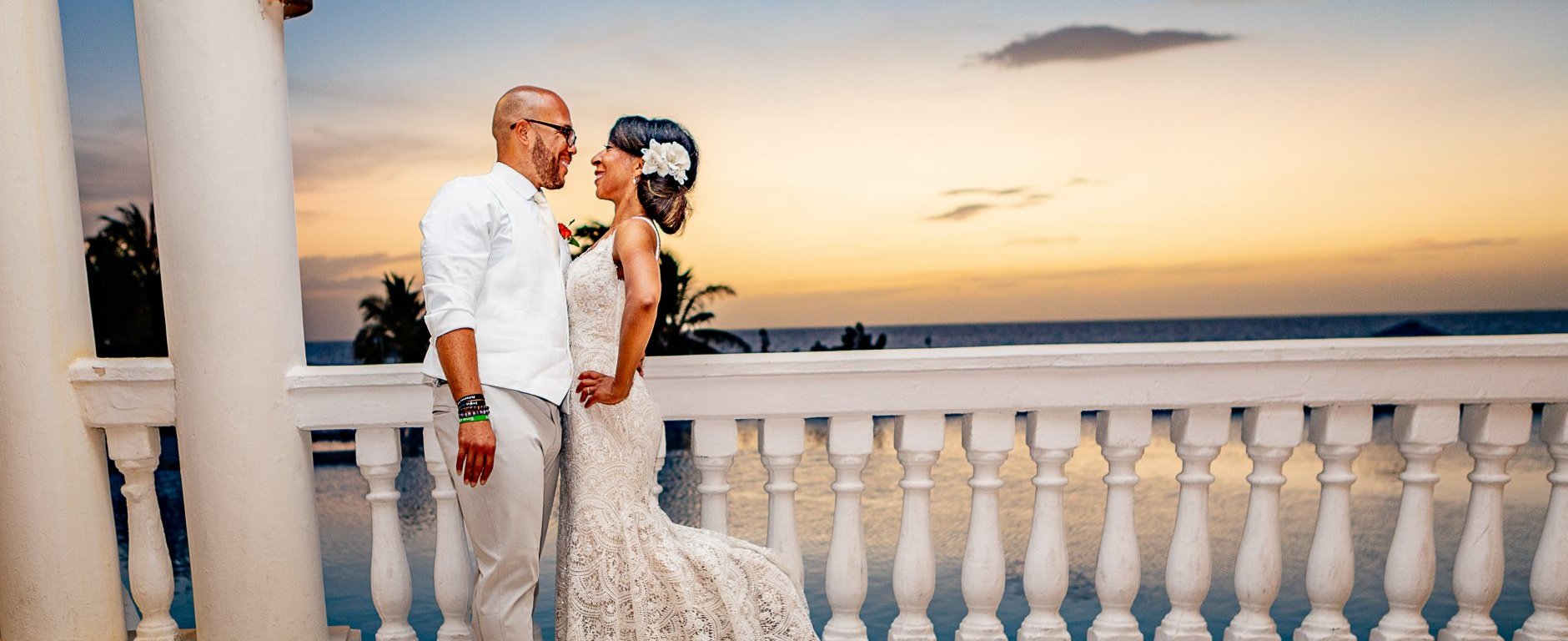 Black couple embracing at wedding after signing up for matchmaking services for professionals