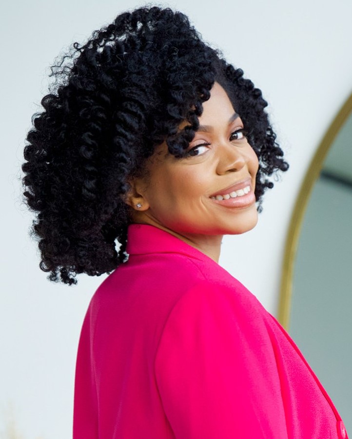 Black matchmaker smiling at the camera