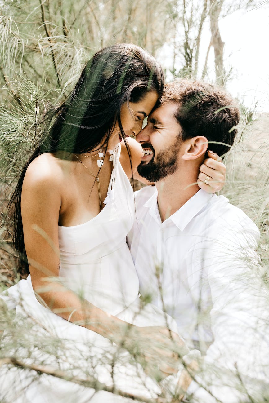 White couple paired by Christian matchmakers sitting in a field