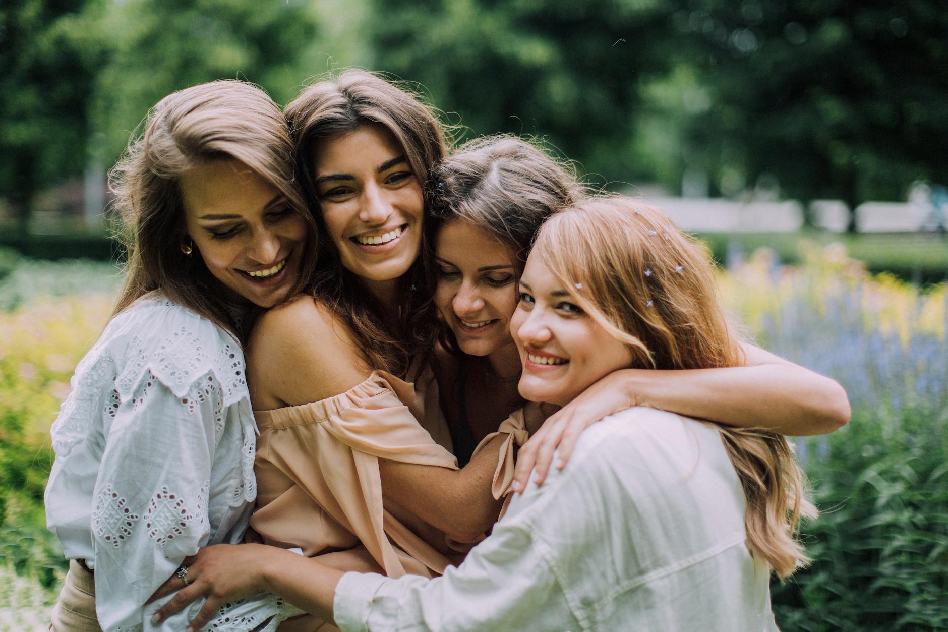 Group of four friends hugging