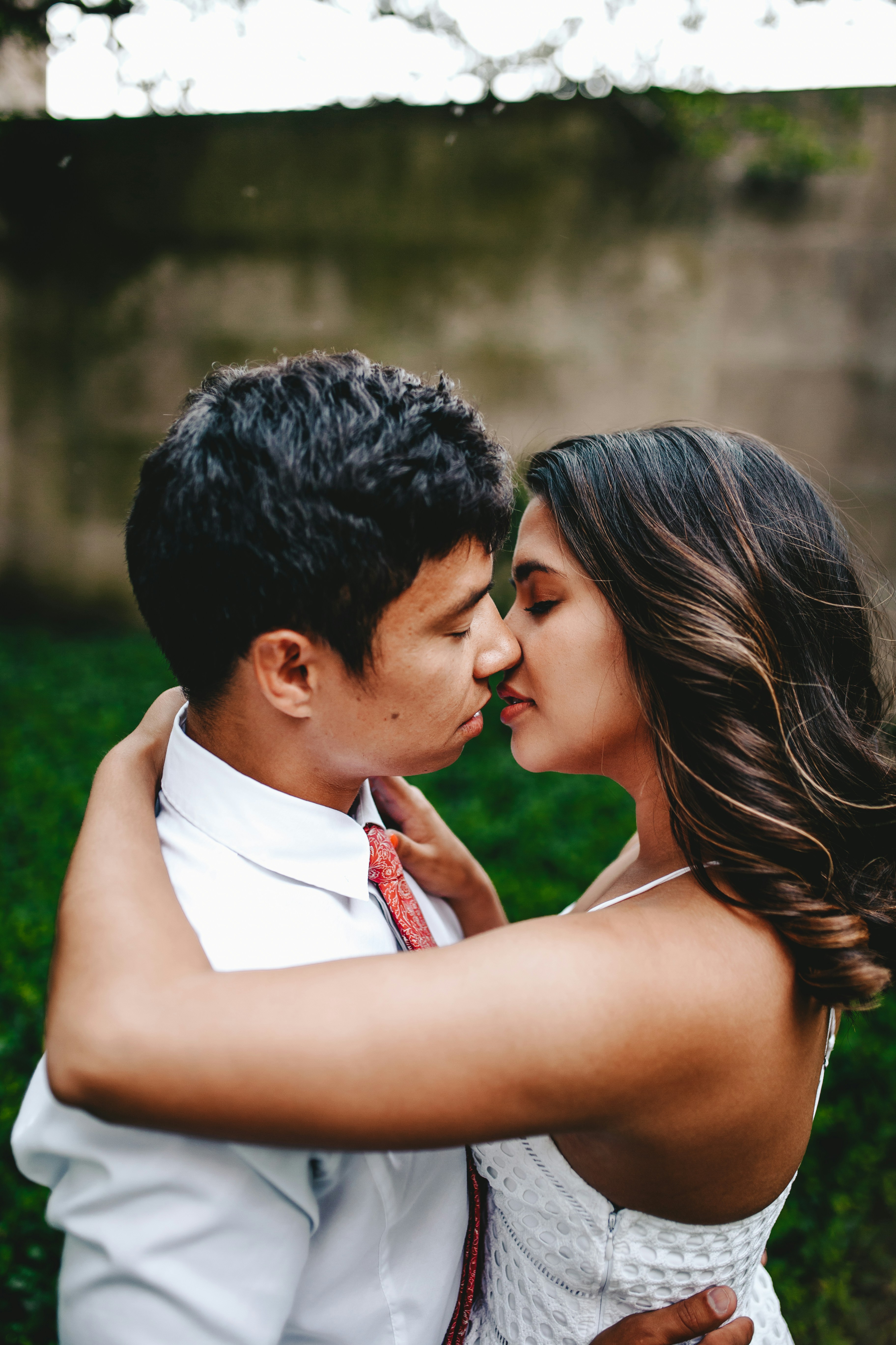 Asian couple kissing paired by matchmakers in Charleston