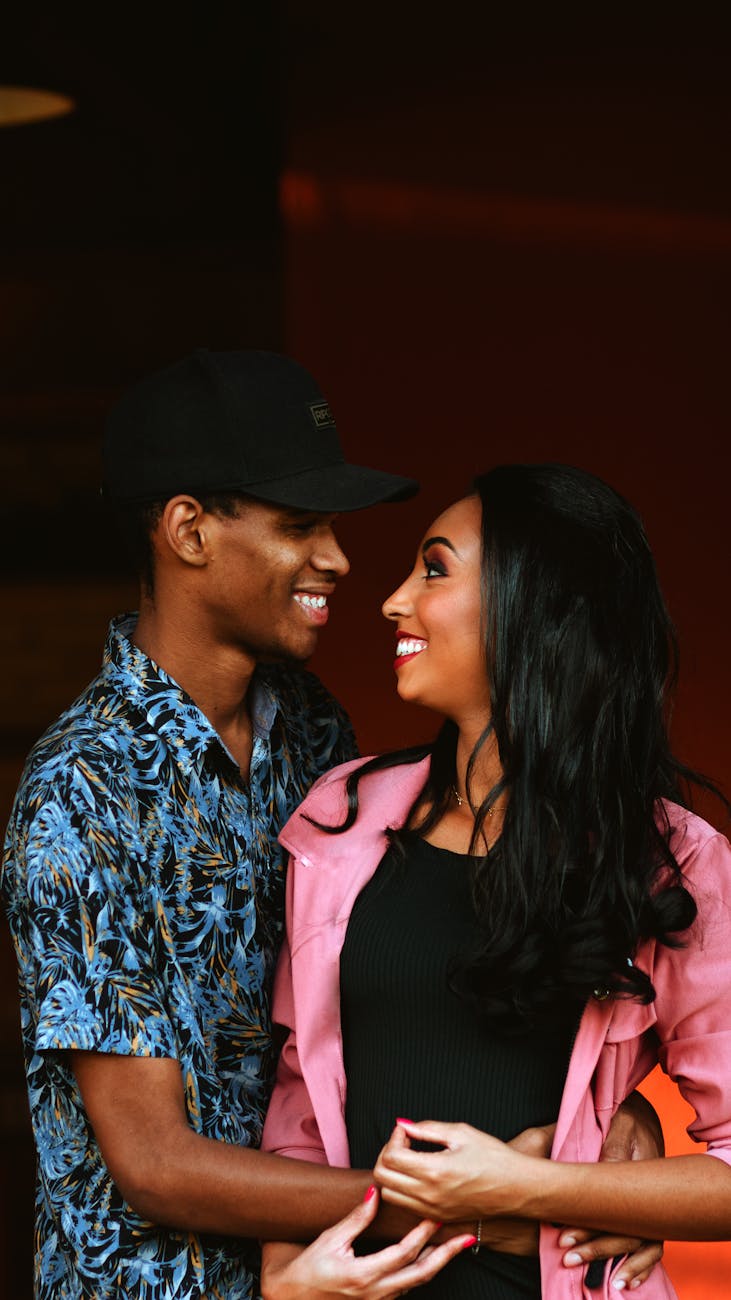 Interracial couple paired by matchmakers in Seattle smiling at each other