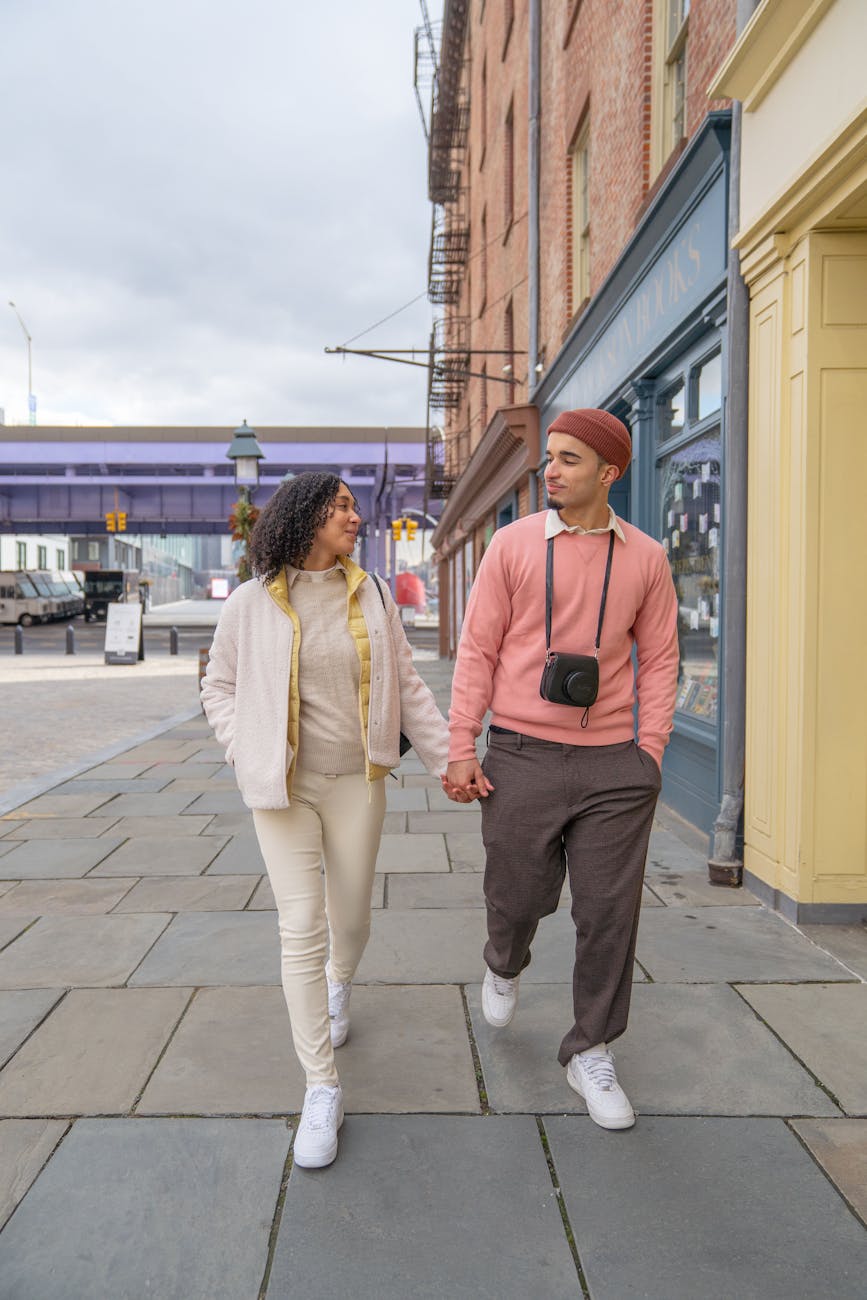 Trendy couple united by matchmakers in Louisville walking on the street