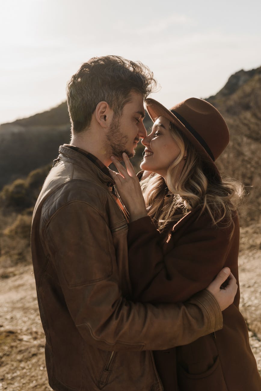 Caucasian couple paired by matchmakers in Louisville smiling at each other outdoors
